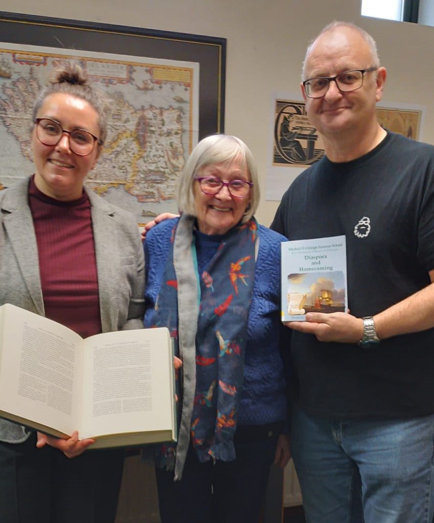 Founding member of the Mícheál Ó Cleirigh Summer School, Caitlín MacAmhlaigh presenting one of the volumes of the Annals of the Four Masters to Anna Kujawa, Ballyshannon Librarian.